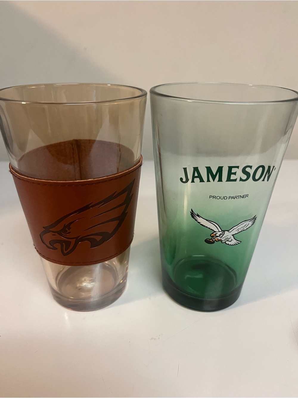 Two Philadelphia Eagles NFL Branded Barware Clear glass has leather grip.GOBIRDS
